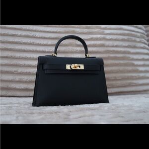 Elegant Black Handbag with Gold Accents